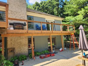 Deck with wood railing and horizontal cable infill